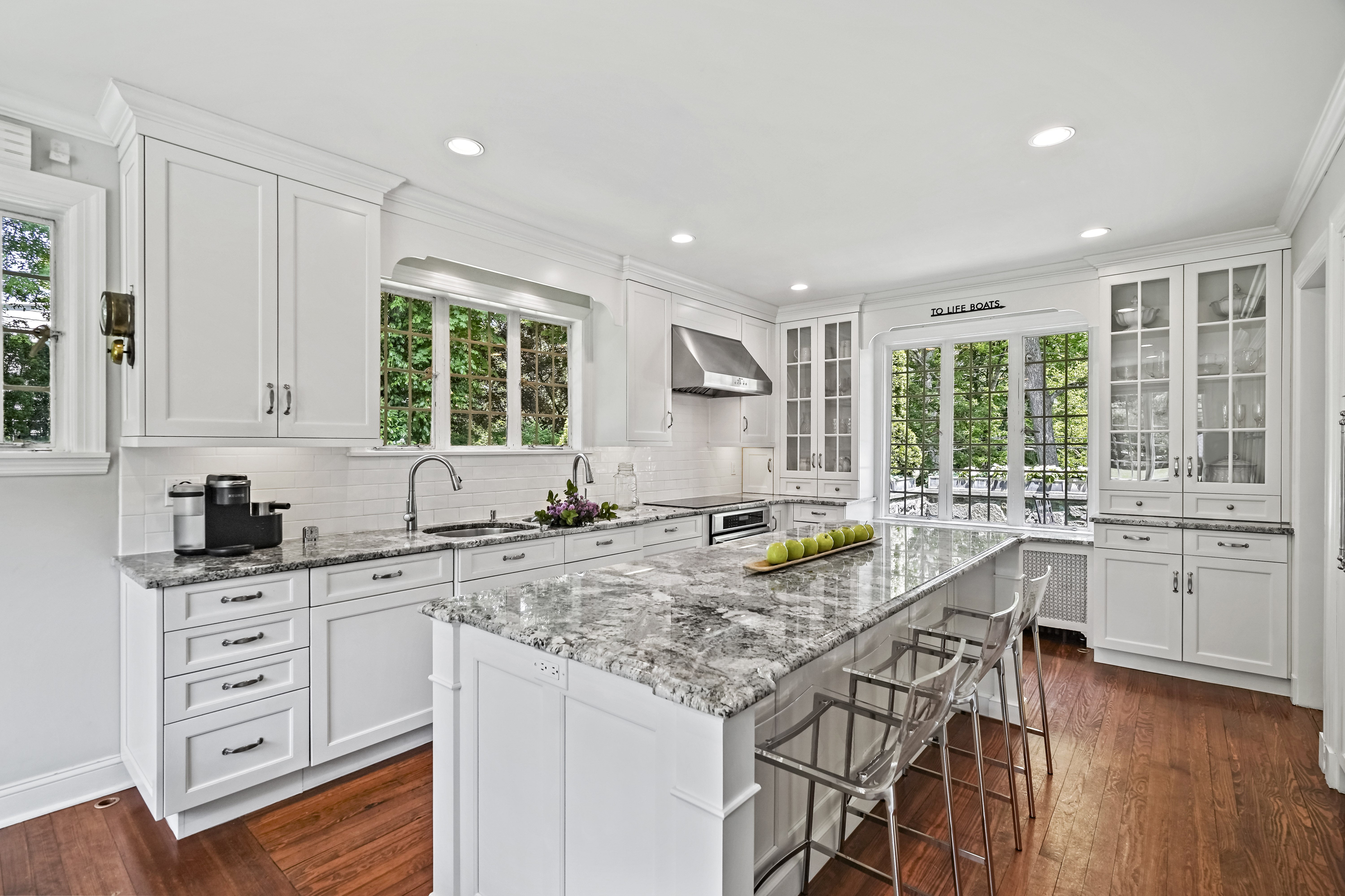19 Avon Road Larchmont, NY 10538 - Photo 6 of 35 a kitchen with granite countertop a sink and cabinets