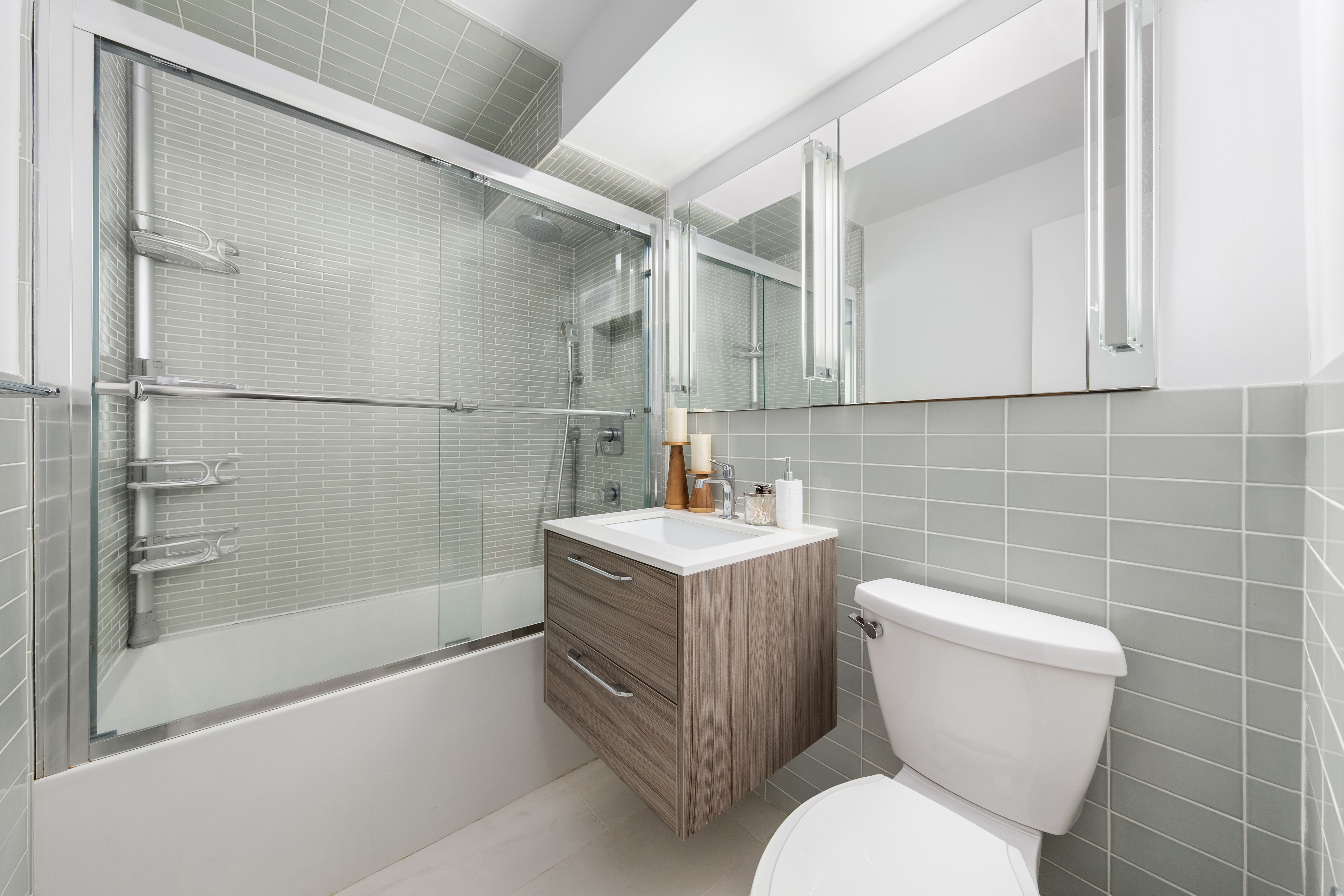 505 East 79th Street, Unit 7L Manhattan, NY 10075 - Photo 6 of 9 a bathroom with a sink a toilet and shower