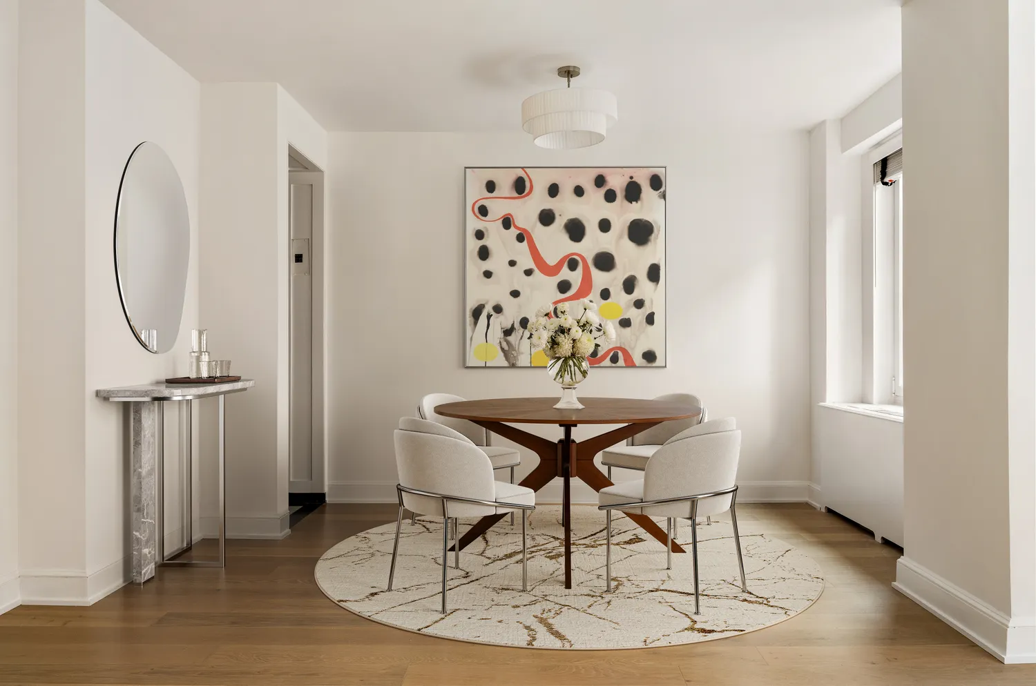 a view of a room with furniture and wooden floor