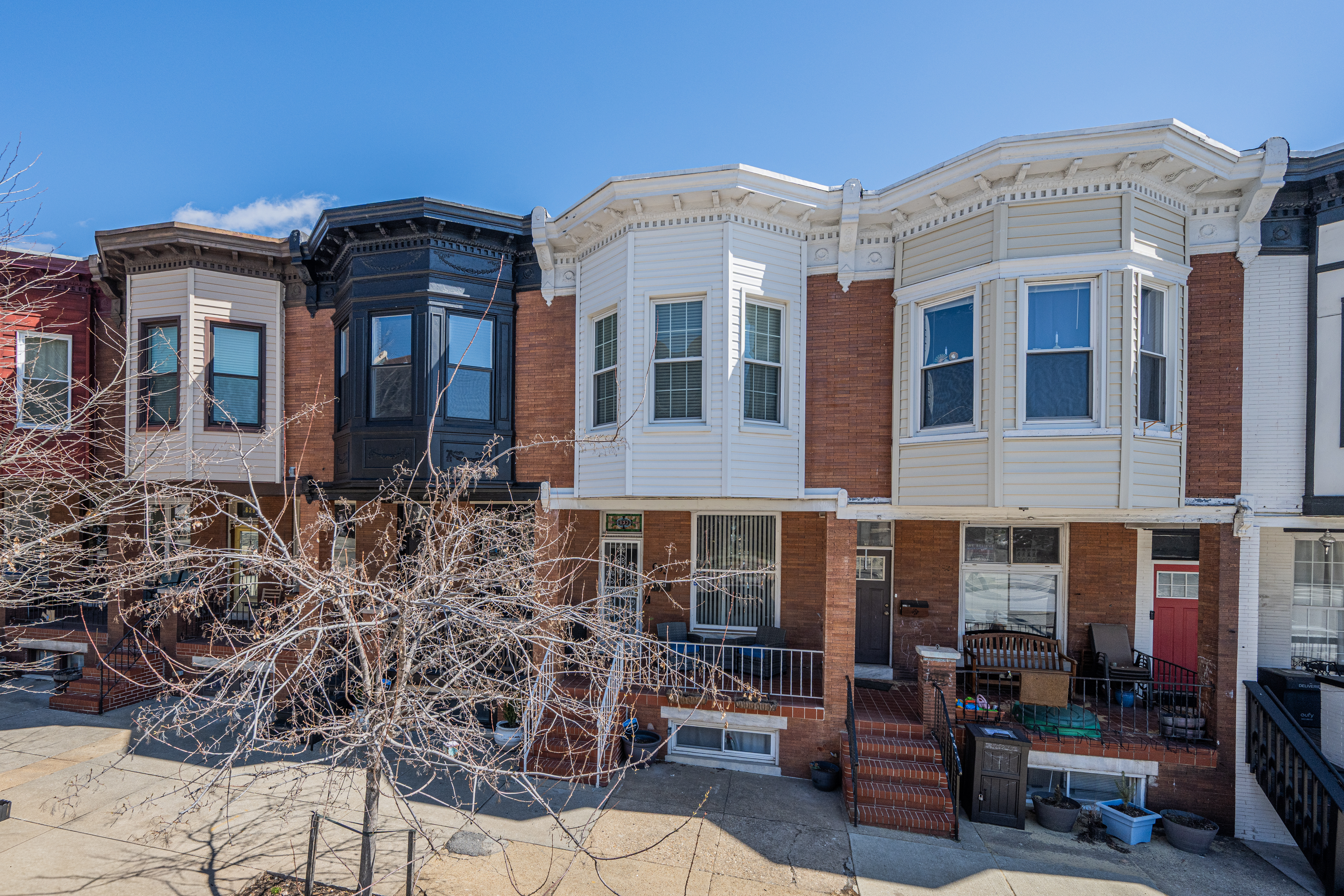 633 South Conkling Street Baltimore, MD 21224 - Photo 3 of 23 a front view of a building with outdoor seating