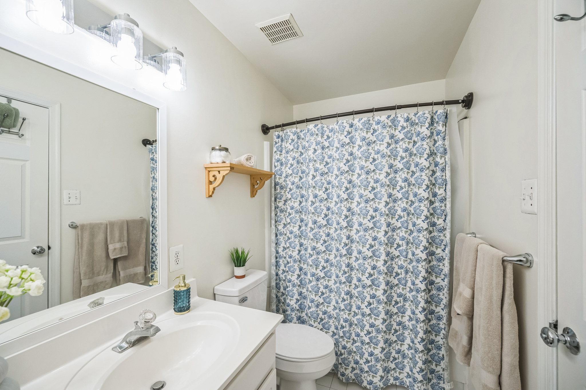 127 Hartman Road Pottstown, PA 19465 - Photo 27 of 42 a bathroom with a sink a toilet and shower curtain