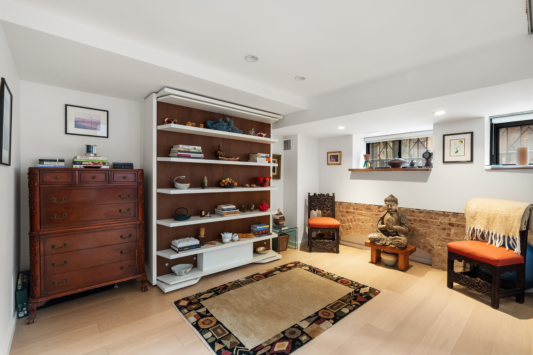 248 East 31st Street, Unit 1D Manhattan, NY 10016 - Photo 4 of 13 a living room with furniture and a dresser