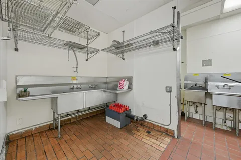 an empty room with window and outdoor view