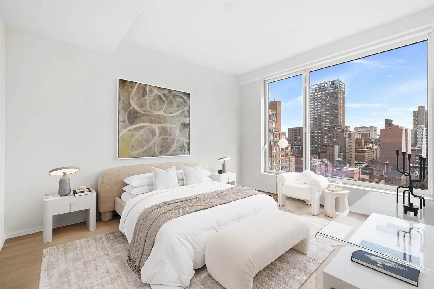 a bedroom with furniture and a large window