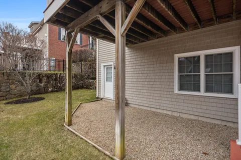 a aerial view of a house with a yard and balcony