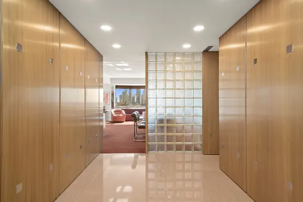 a bathroom with a glass shower door