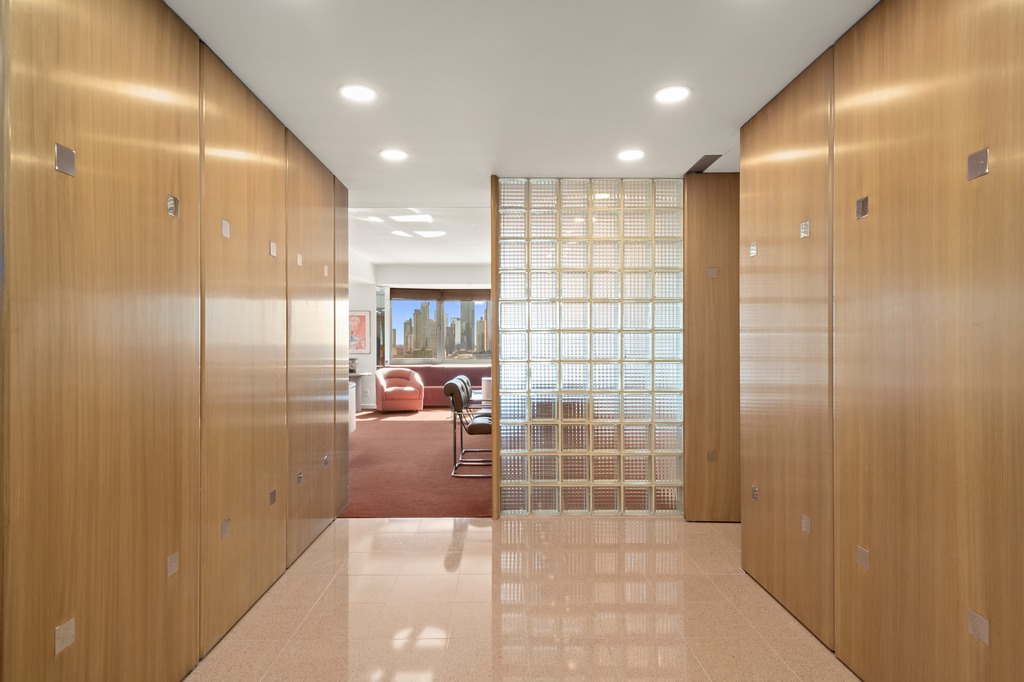 25 Sutton Place South, Unit 18M Manhattan, NY 10022 - Photo 4 of 11 a bathroom with a glass shower door