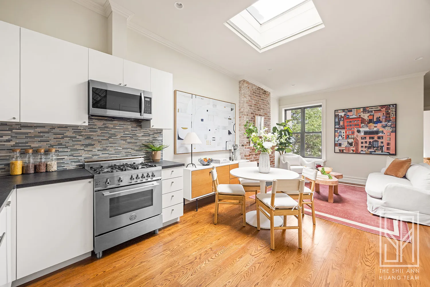 a living room with furniture wooden floor and a fireplace