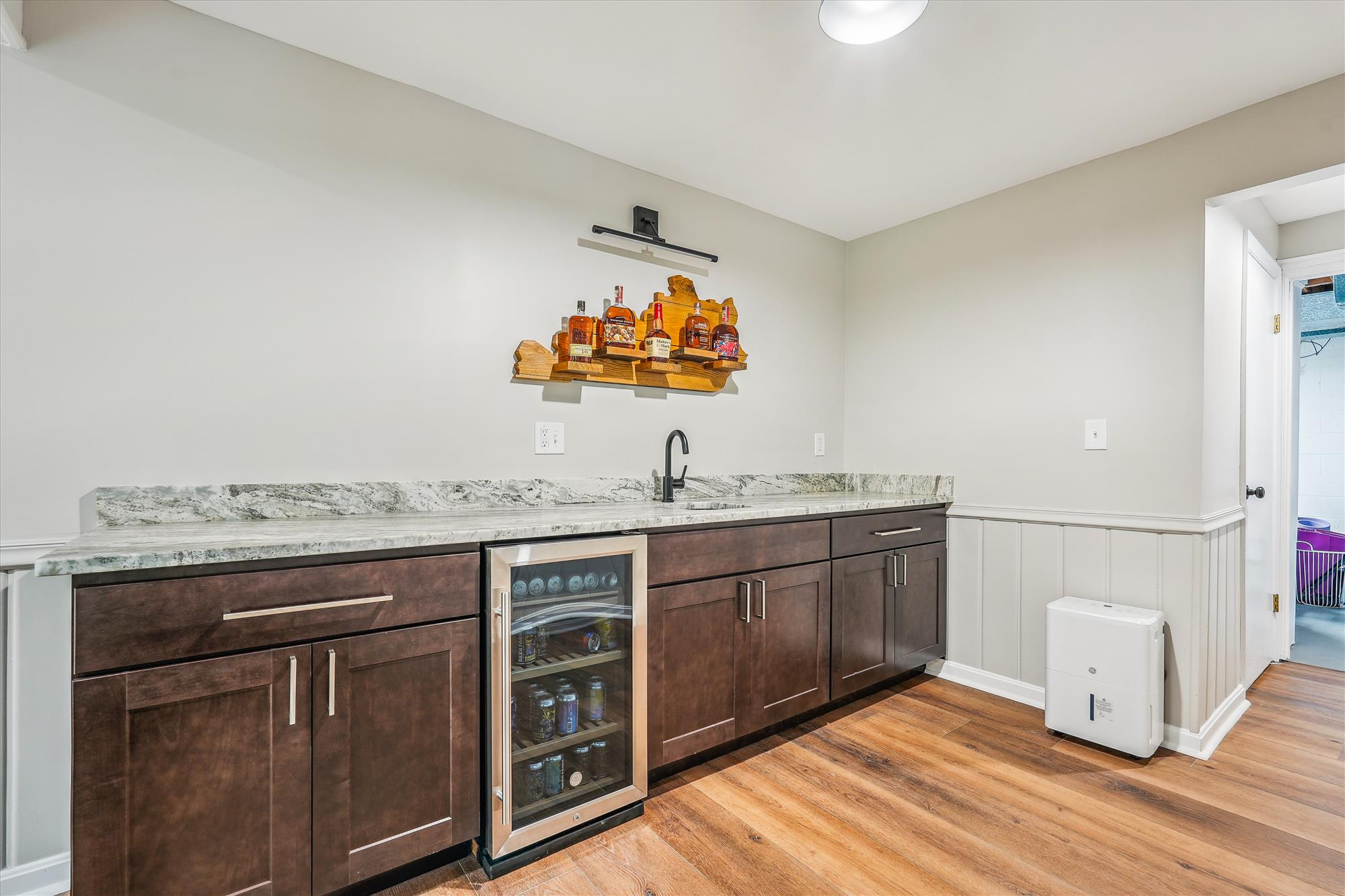 9904 Carter Road Bethesda, MD 20817 - Photo 35 of 41 a spacious bathroom with a granite countertop sink a toilet and a mirror