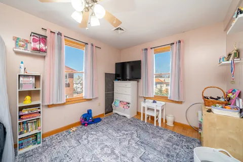 a living room with fireplace furniture and a flat screen tv