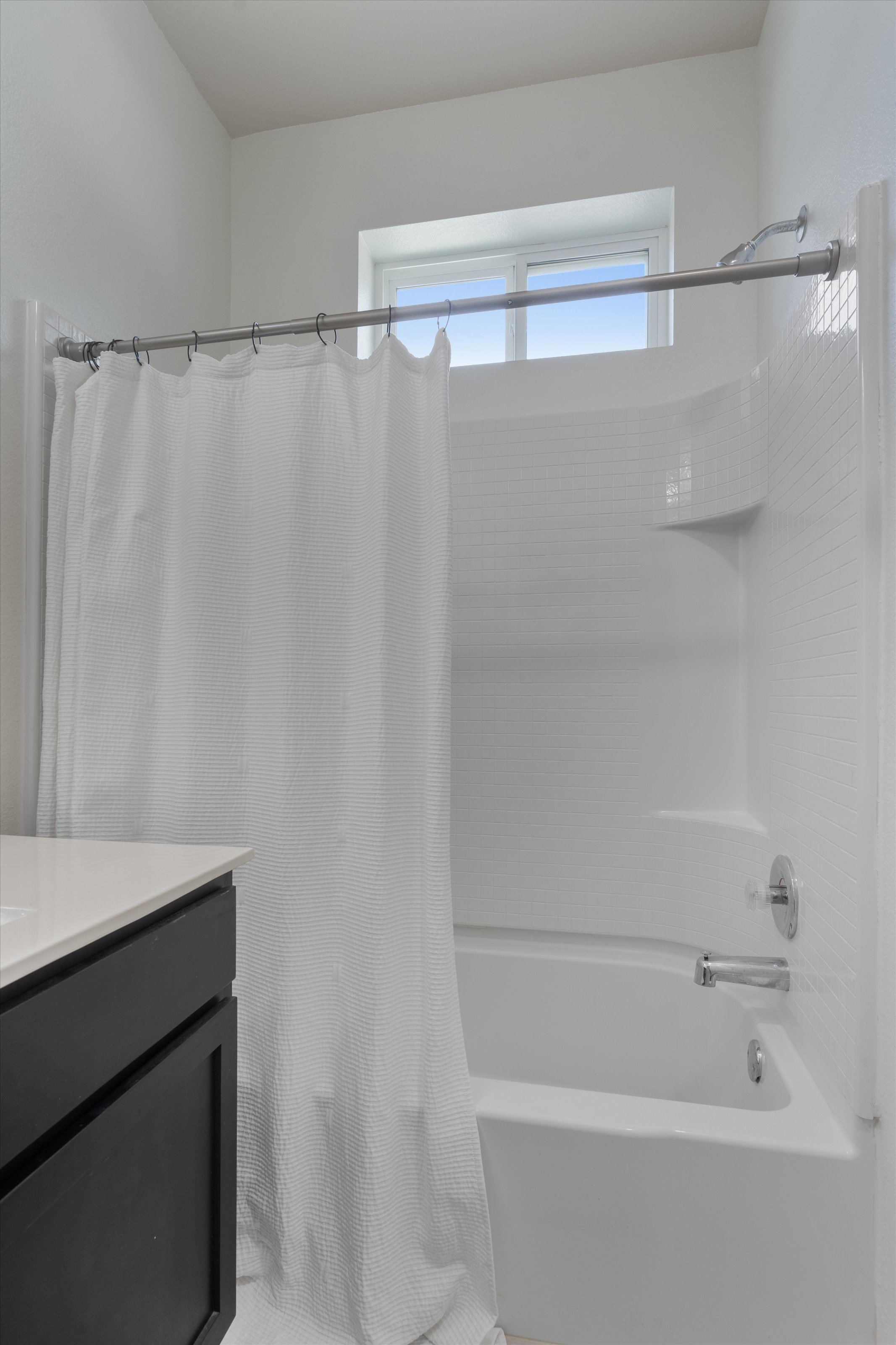 4330 Olenick Street Austin, TX 78723 - Photo 14 of 29 a bathroom with a shower and a sink