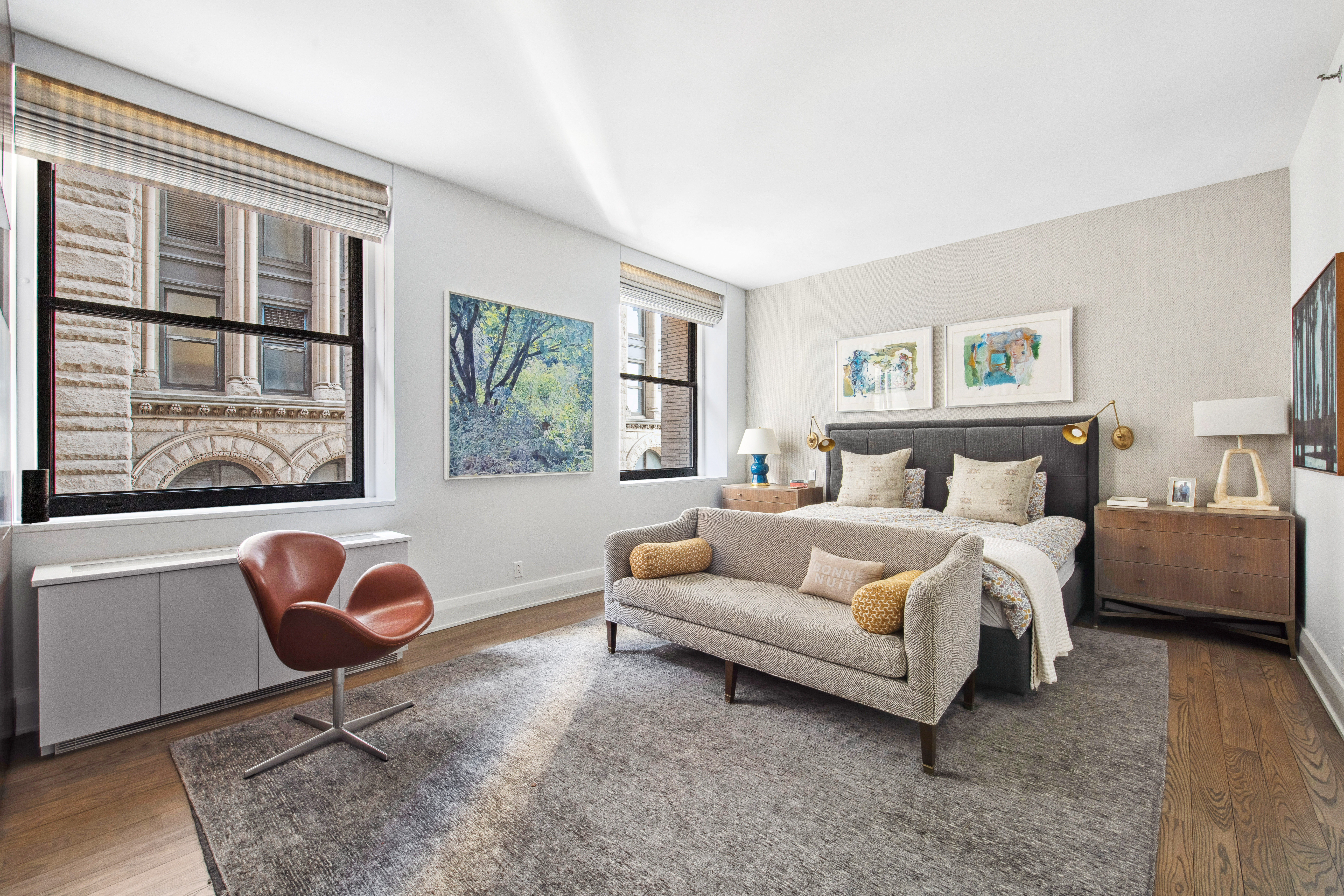 150 Nassau Street, Unit 10A Manhattan, NY 10038 - Photo 6 of 20 a bedroom with a bed and a large window