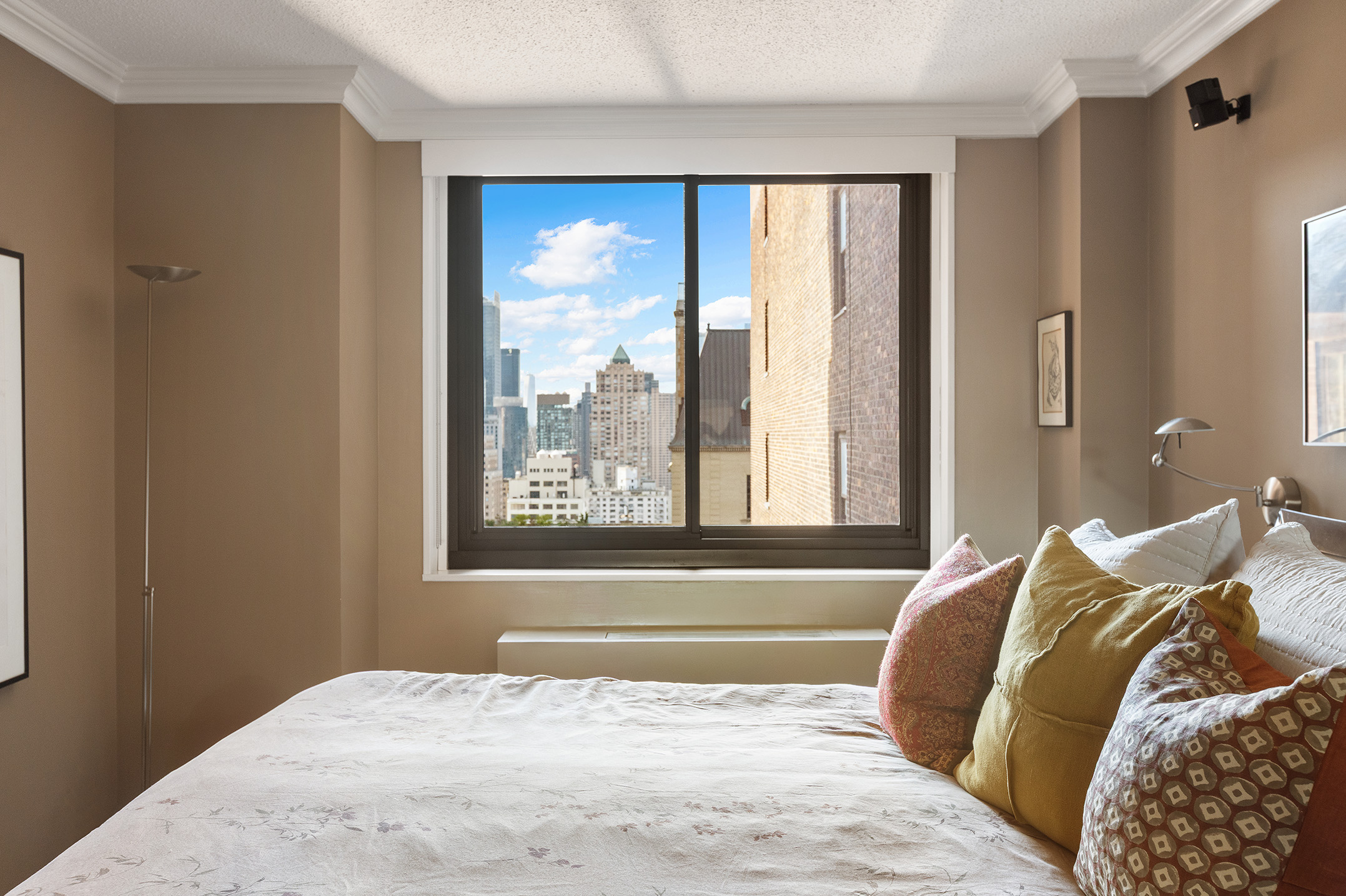 347 West 57th Street, Unit 25AB Manhattan, NY 10019 - Photo 8 of 21 a bedroom with a bed and a window