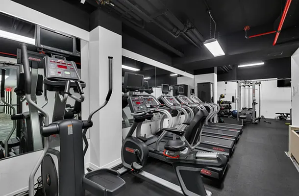540 West 49th Street, Unit 206N Manhattan, NY 10019 - Photo 8 of 14 a view of a room with gym equipment