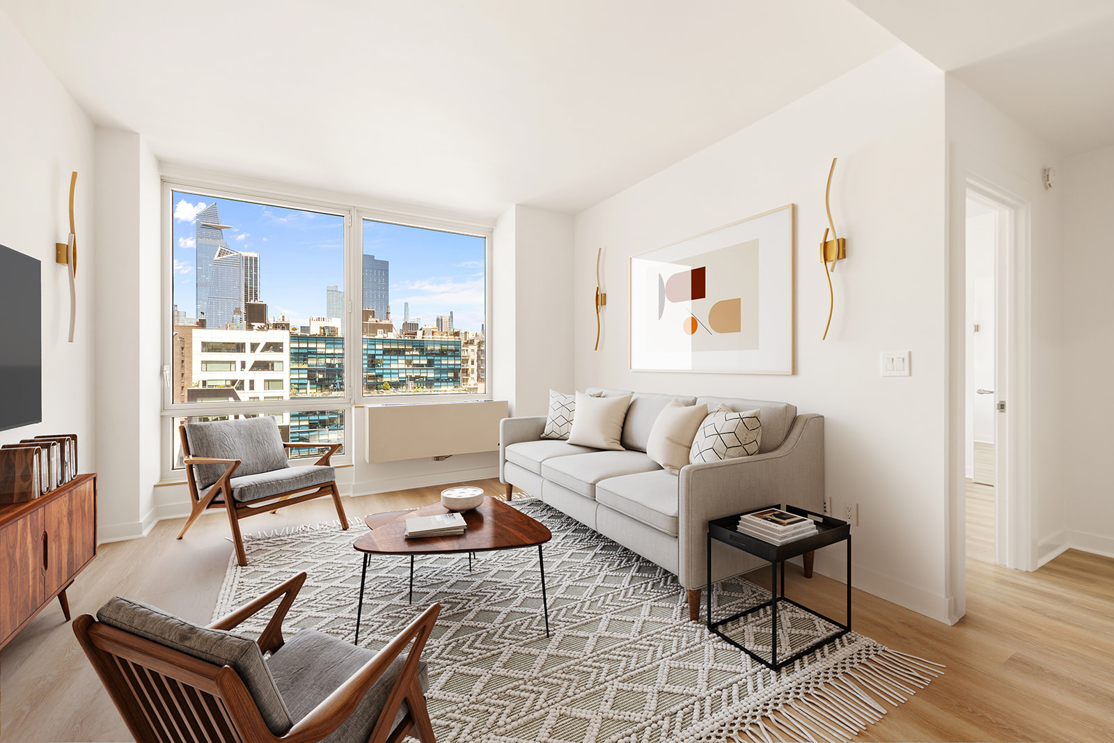 450 West 17th Street, Unit 1123 Manhattan, NY 10011 - Photo 1 of 6 a living room with furniture and a window