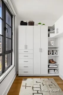 a view of a closet area with an empty room
