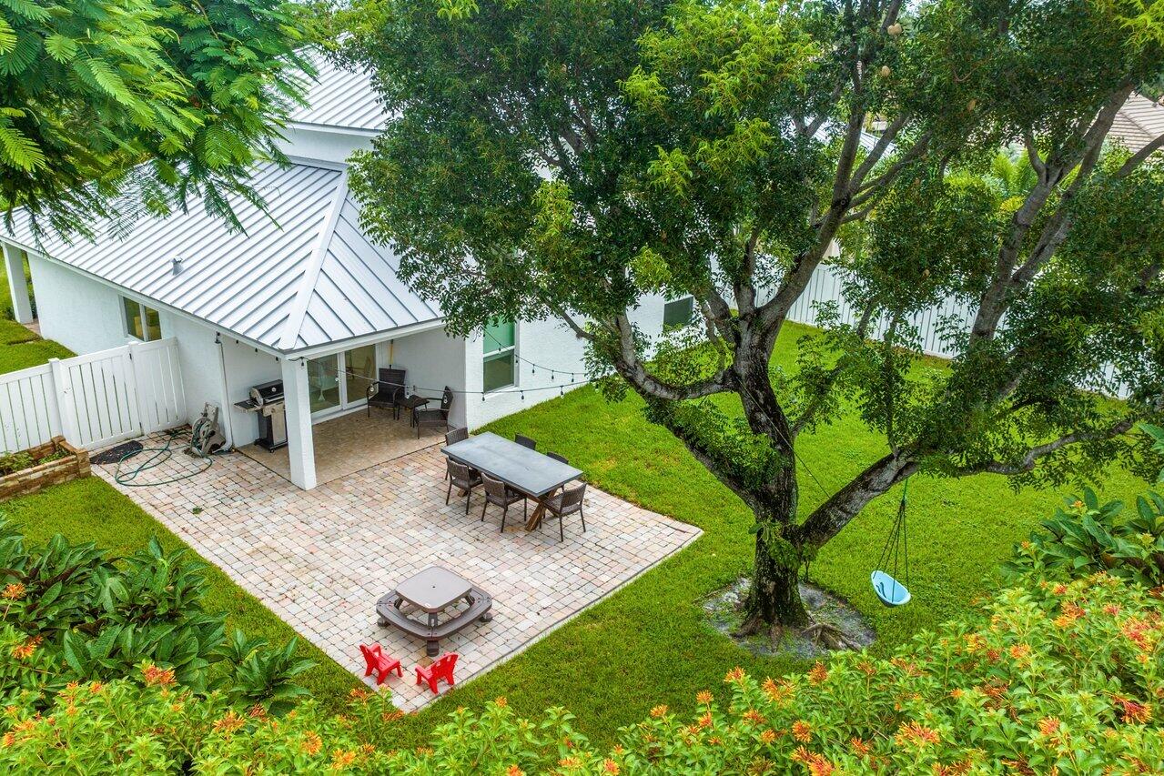 1182 Canoe Point Delray Beach, FL 33444 - Photo 33 of 46 a view of a backyard with a patio