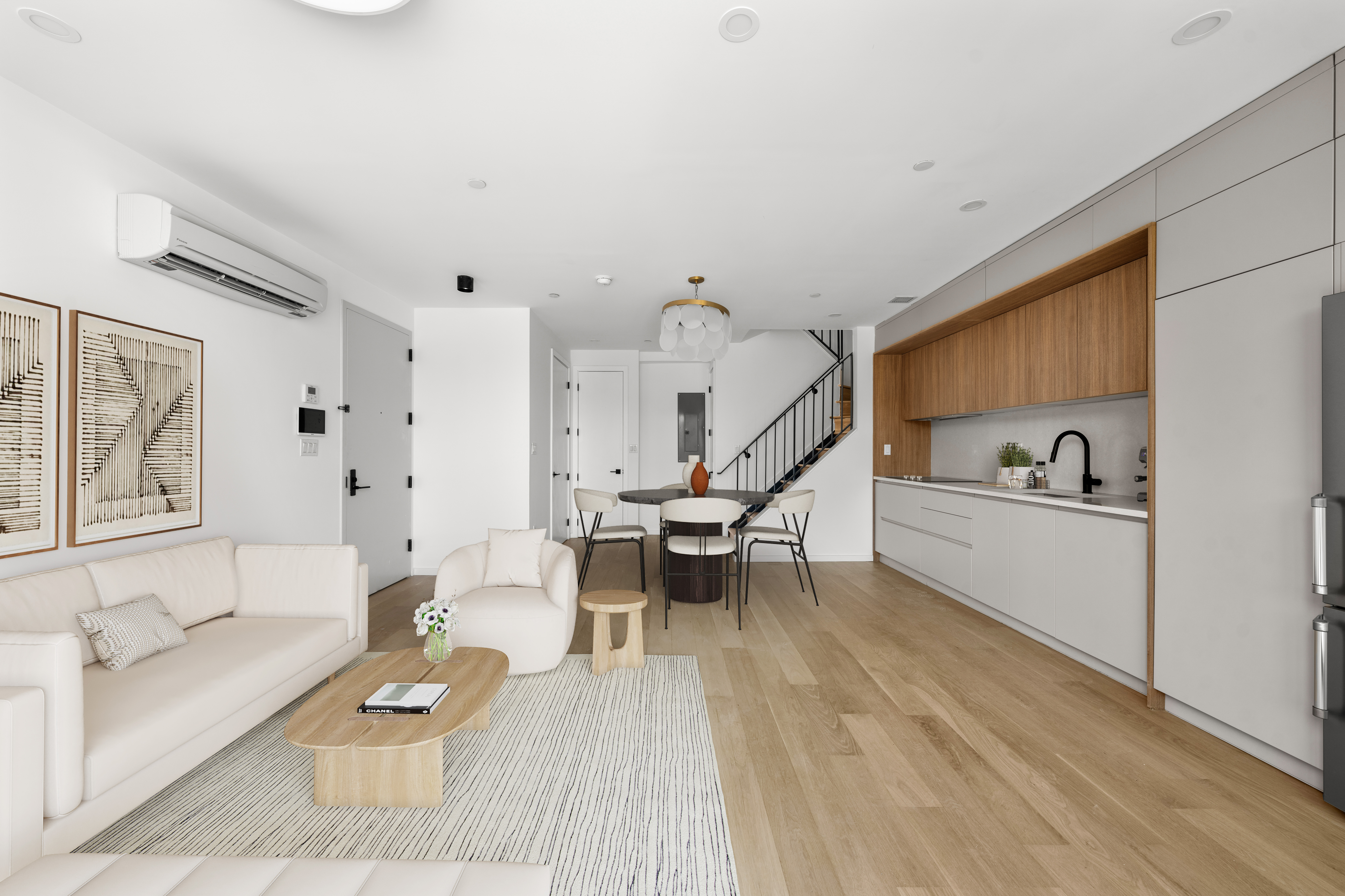 14-35 Broadway, Unit 1A Queens, NY 11106 - Photo 4 of 20 a living room with furniture and wooden floor