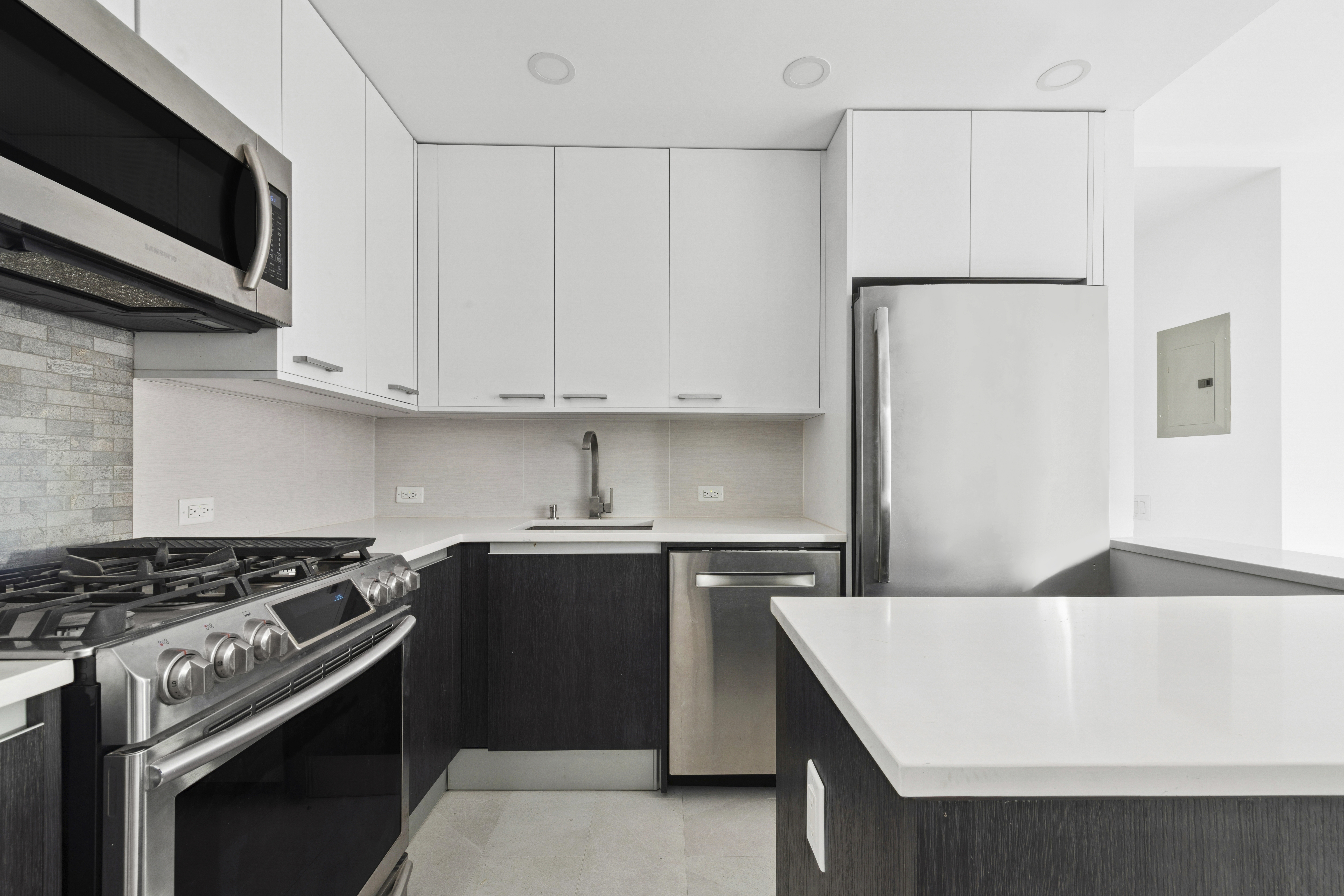 330 East 75th Street, Unit 5B Manhattan, NY 10021 - Photo 2 of 11 a kitchen with a stove and a refrigerator