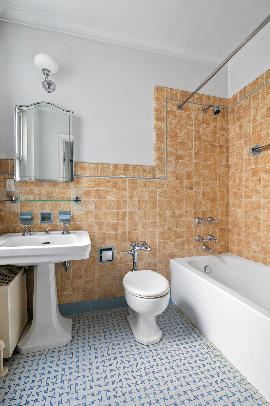 15 West 81st Street, Unit 10B Manhattan, NY 10024 - Photo 10 of 19 a bathroom with a sink a toilet and shower