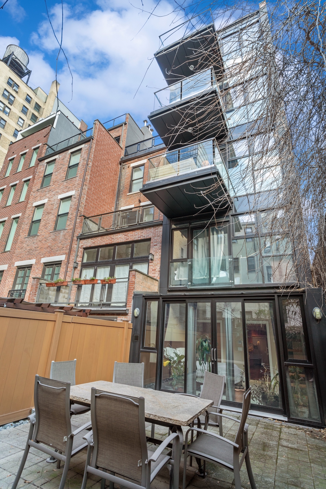 258 West 71st Street, Unit BR Manhattan, NY 10023 - Photo 2 of 13 a view of a chairs and table on the deck