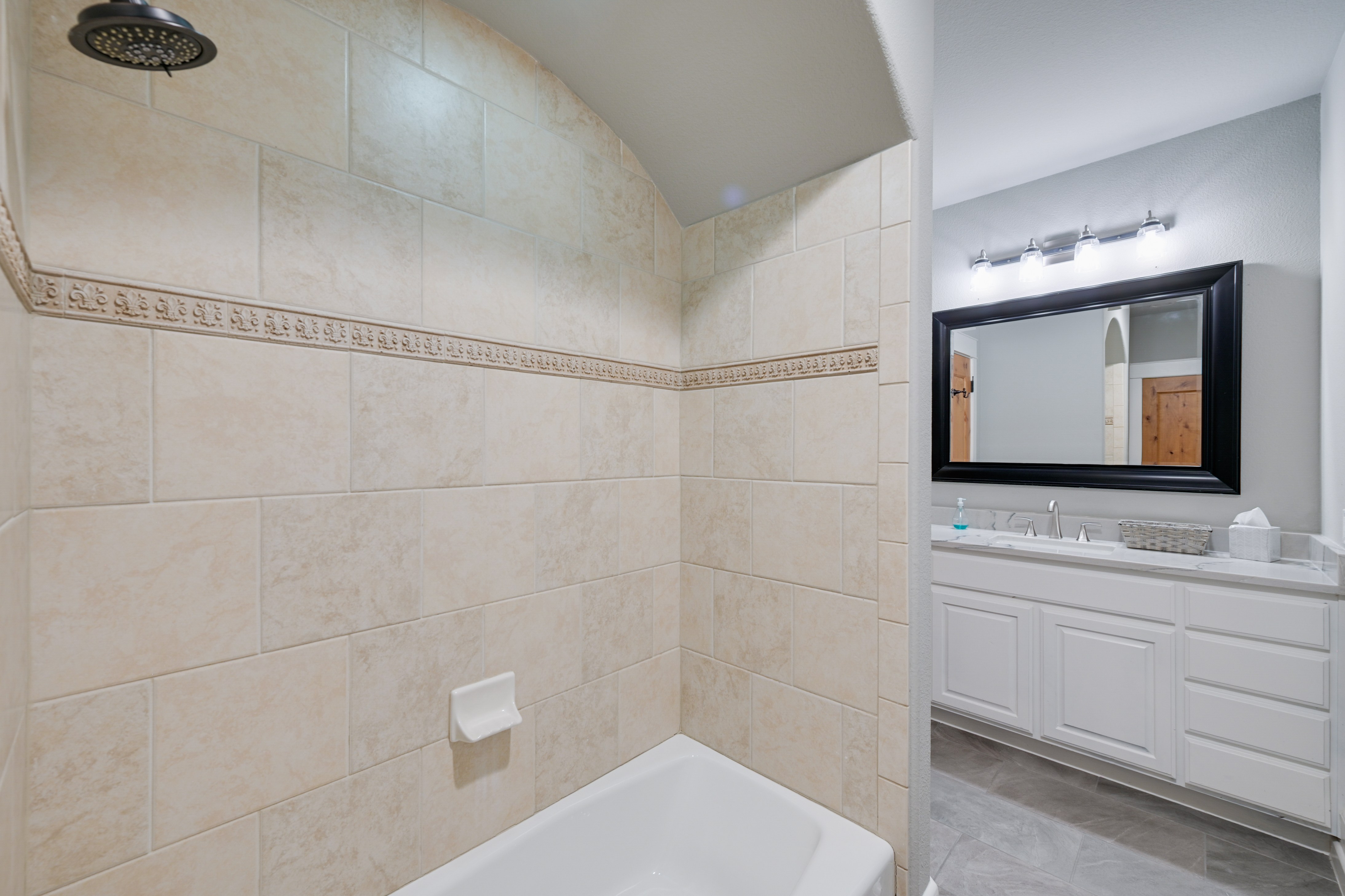 14913 Murfin Road Austin, TX 78734 - Photo 25 of 40 a bathroom with a toilet a sink and mirror