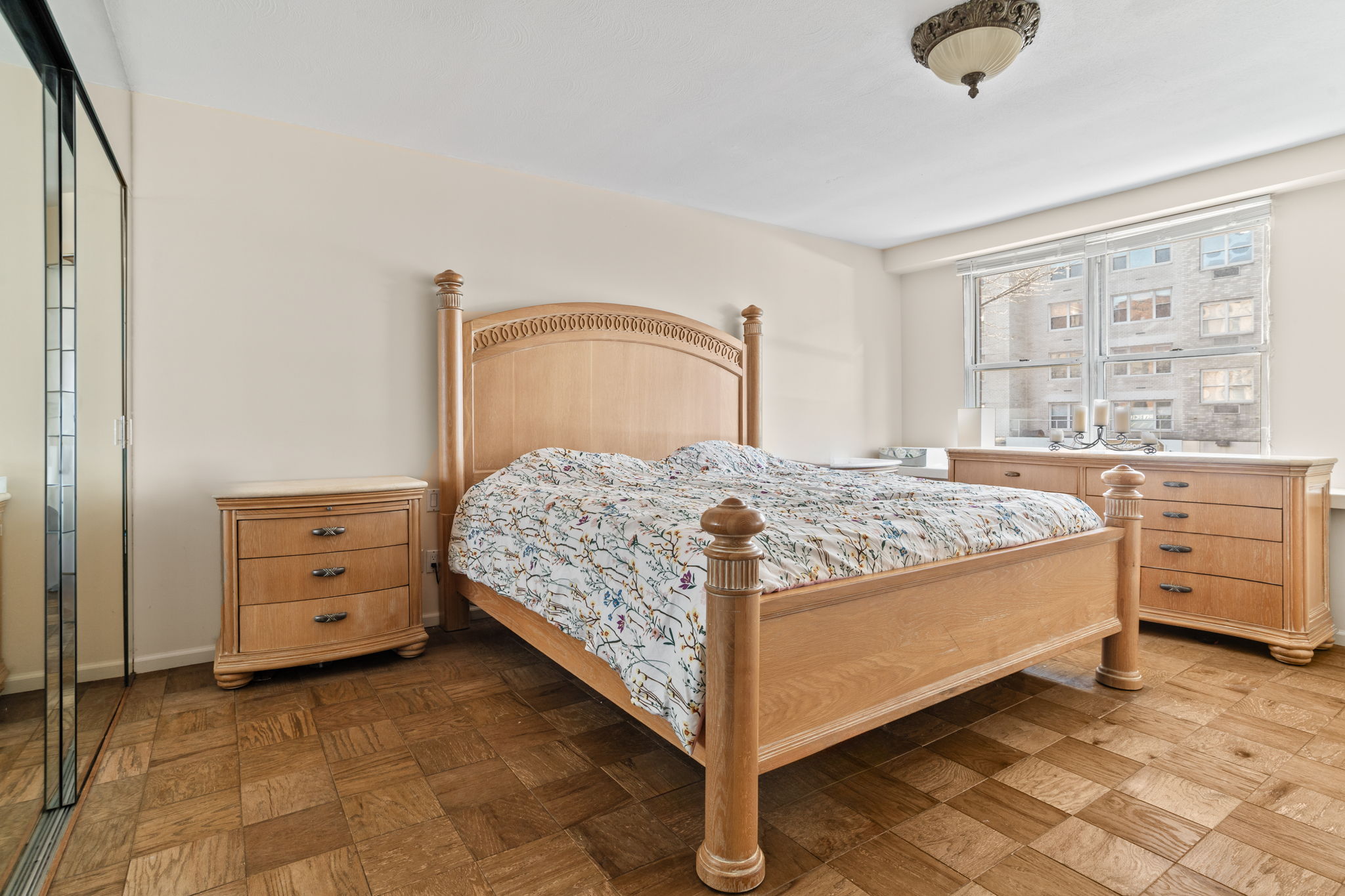 363 East 76th Street, Unit 2F Manhattan, NY 10075 - Photo 9 of 21 a bedroom with a bed and a dresser