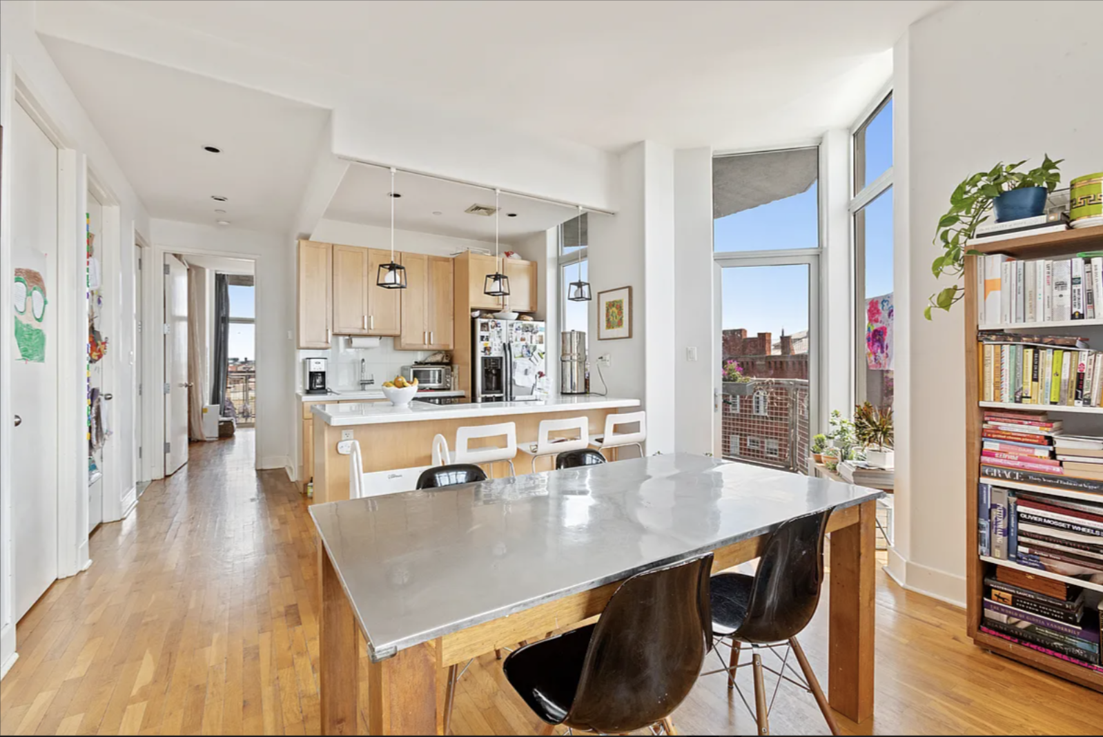 200 Franklin Street, Unit 4B Brooklyn, NY 11222 - Photo 2 of 10 a dining hall with stainless steel appliances a dining table chairs with wooden floor and next to a large window