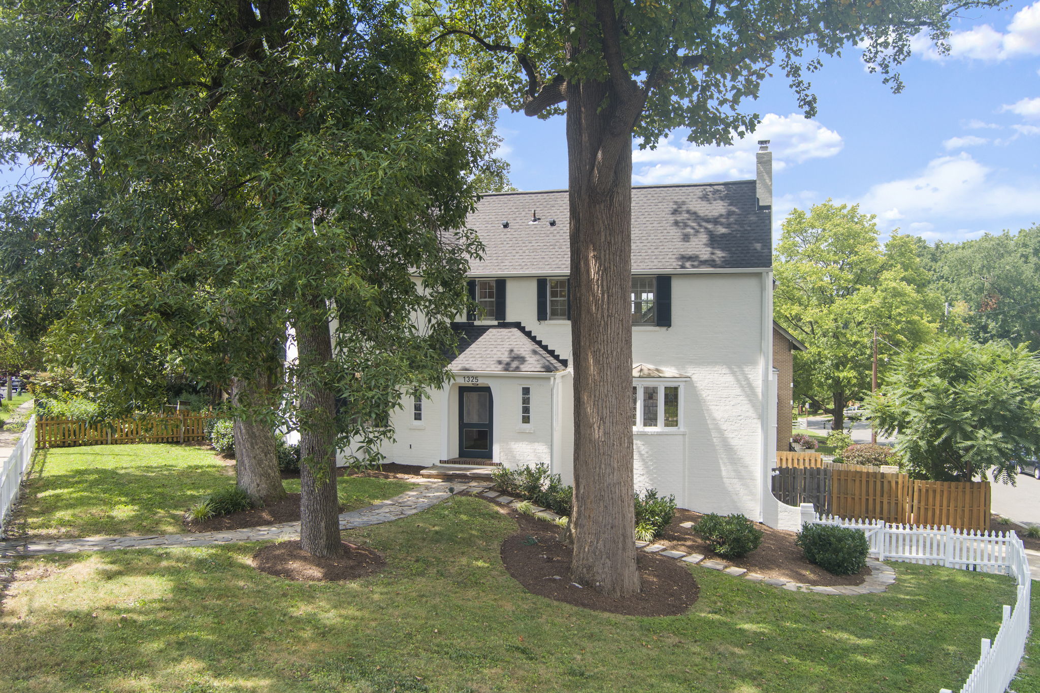 1325 Locust Road Northwest Washington, DC 20012 - Photo 2 of 56 a front view of a house with a yard