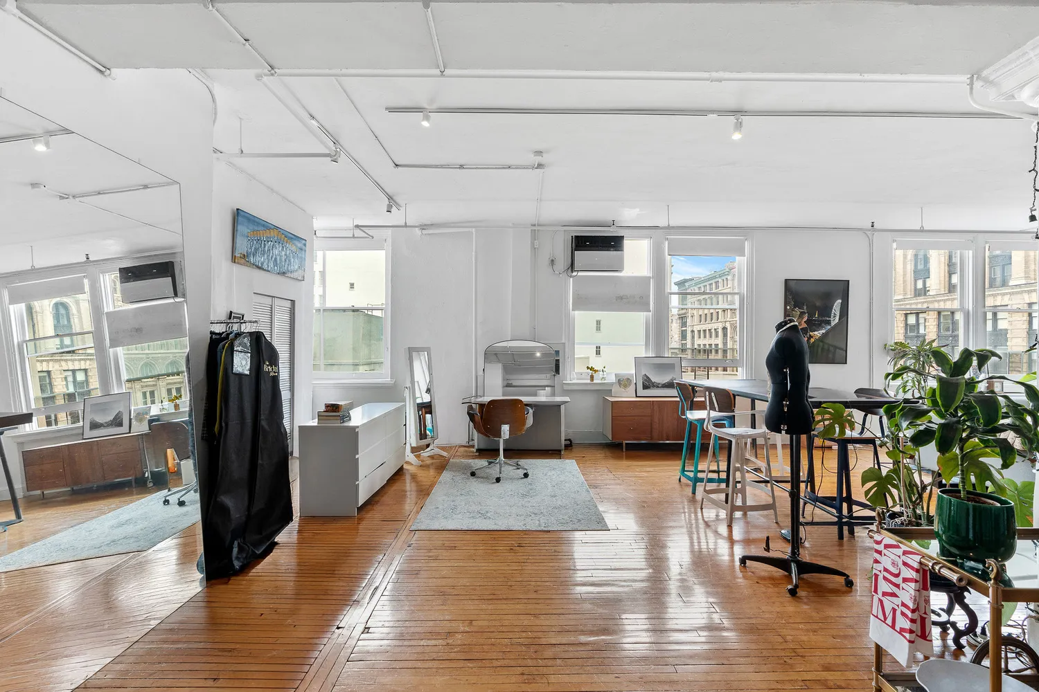 a view of a dining room with furniture wooden floor and next to a window