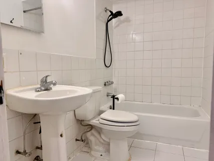 a bathroom with a sink a toilet and a bathtub