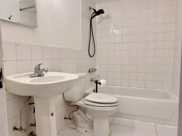 a bathroom with a sink a toilet and a bathtub