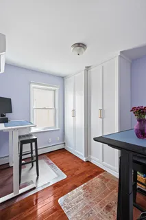 a bedroom with a bed and a table in it