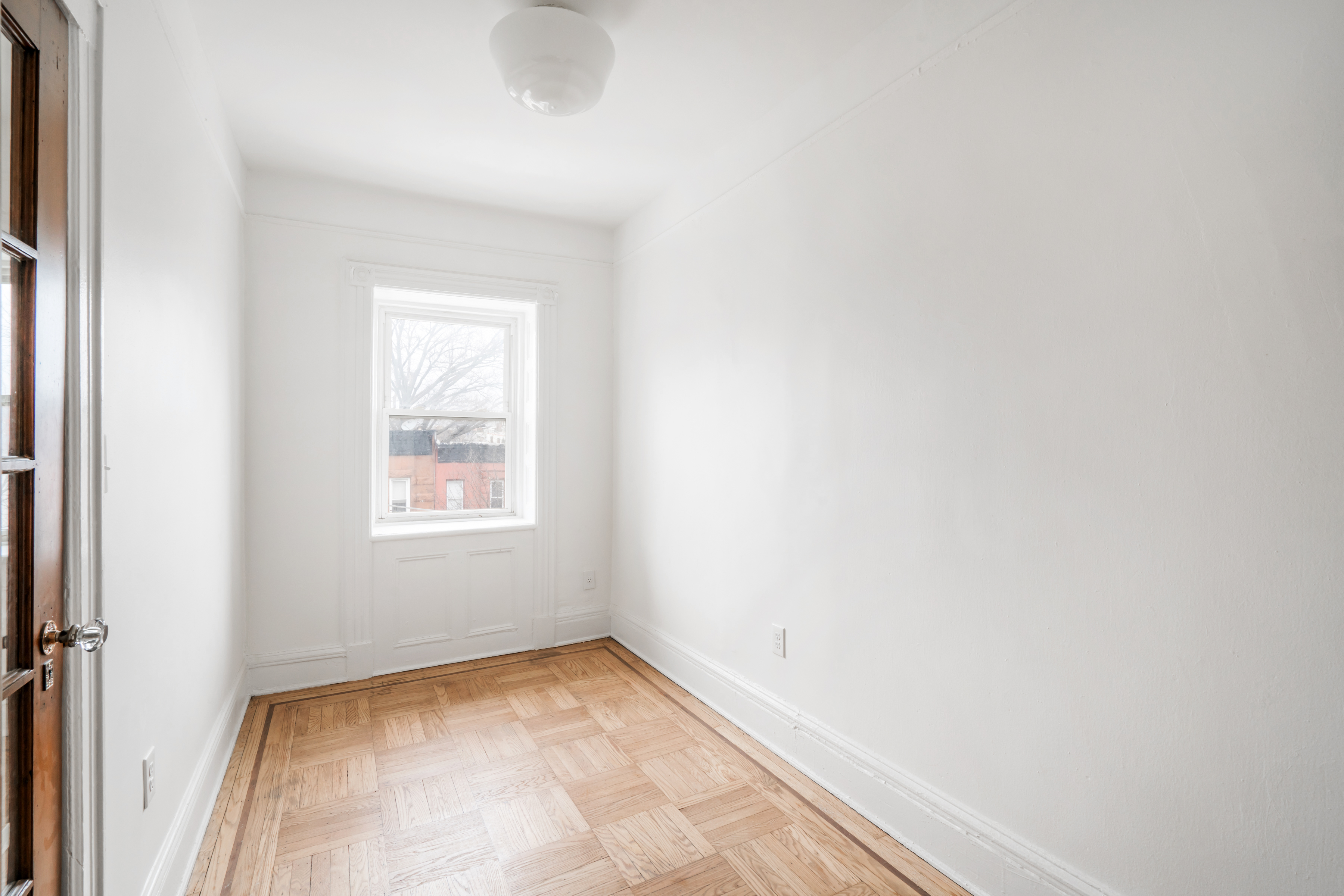 670 Macon Street, Unit 2 Brooklyn, NY 11233 - Photo 11 of 16 a view of a room that has a window in it