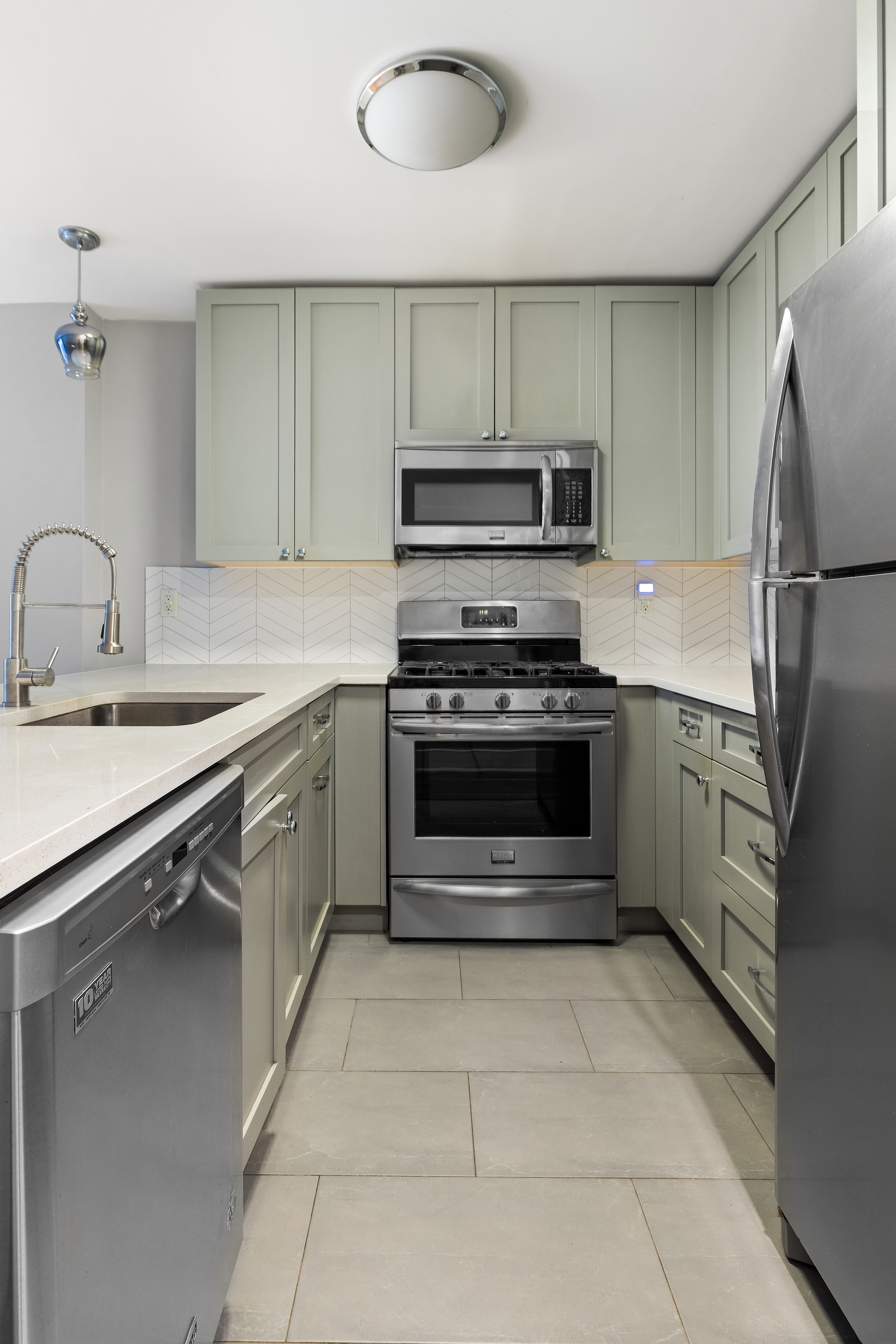 272 Prospect Place, Unit GARDEN Brooklyn, NY 11238 - Photo 4 of 8 a kitchen with a stove sink and refrigerator
