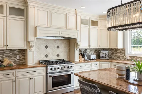 a kitchen with a refrigerator and a sink