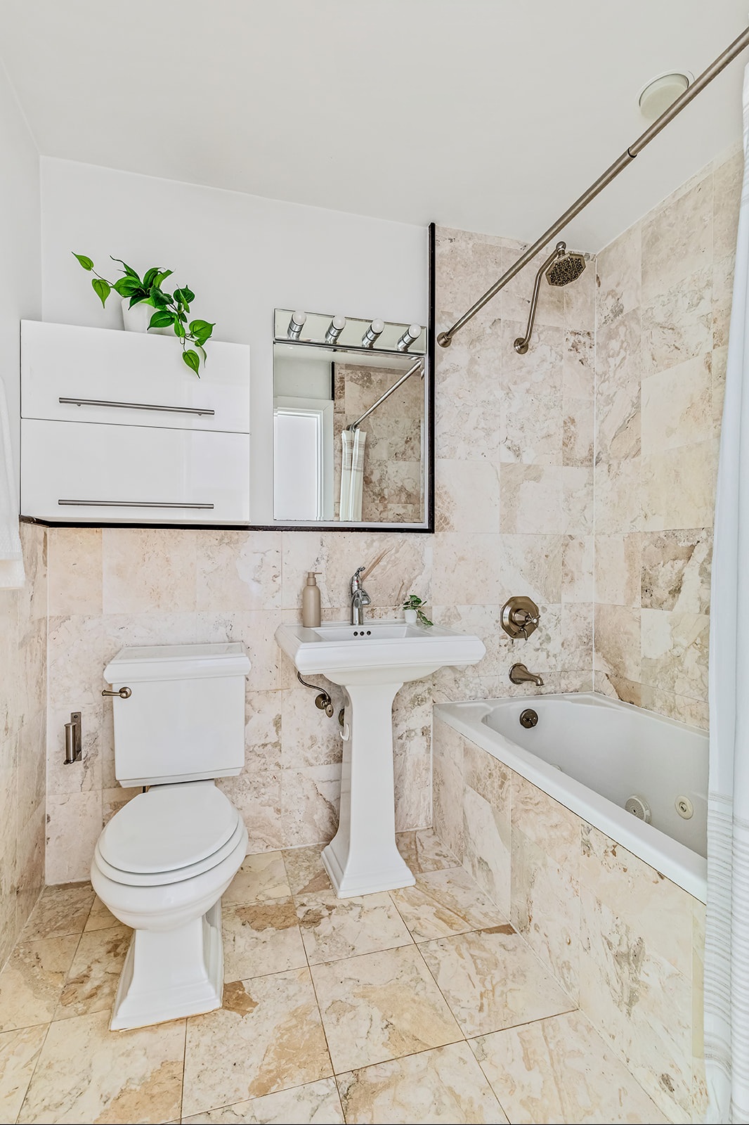 372 15th Street, Unit 2A Brooklyn, NY 11215 - Photo 6 of 10 a bathroom with a sink a toilet and a bathtub