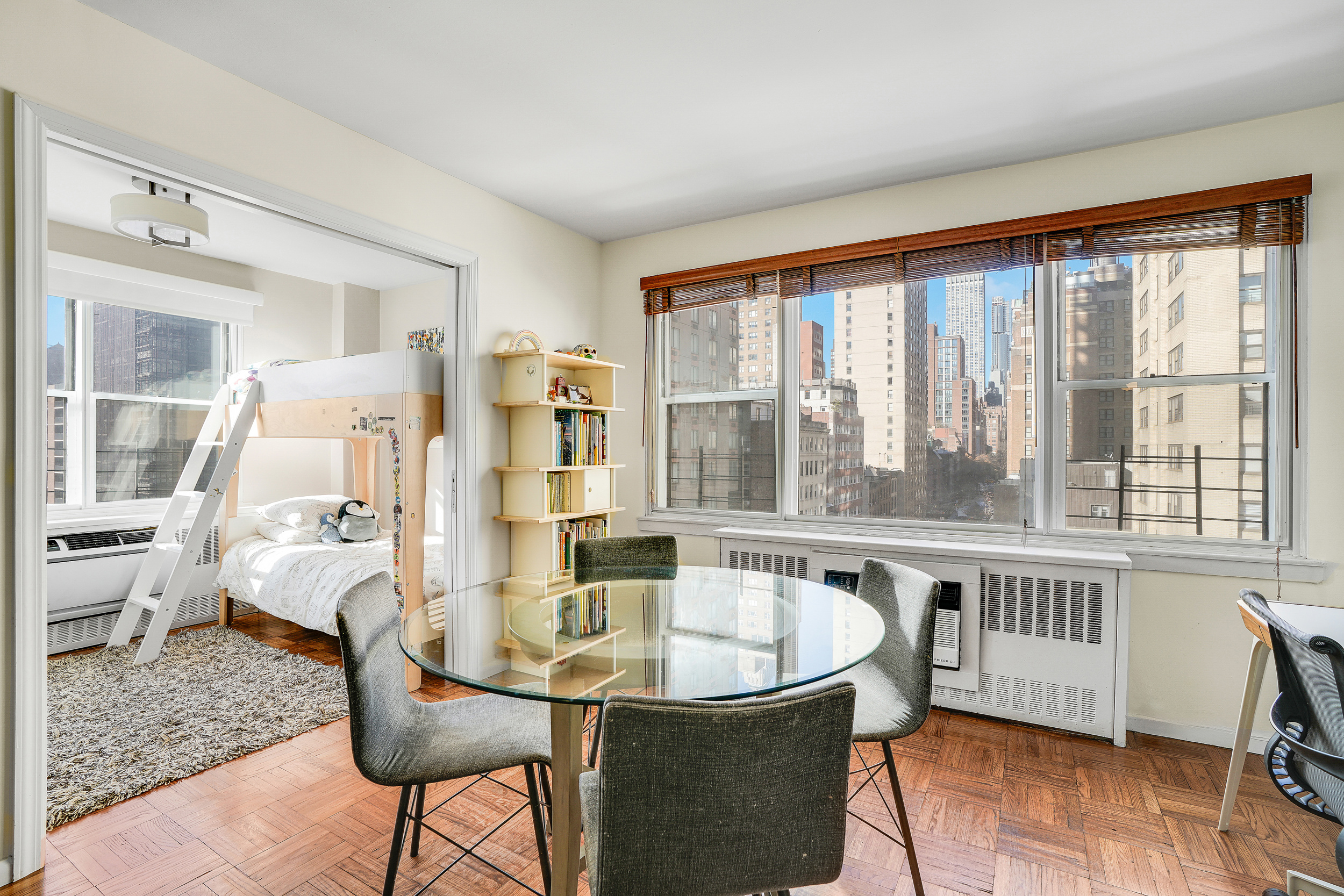 201 East 37th Street, Unit 11D Manhattan, NY 10016 - Photo 4 of 11 a living room with furniture and a large window