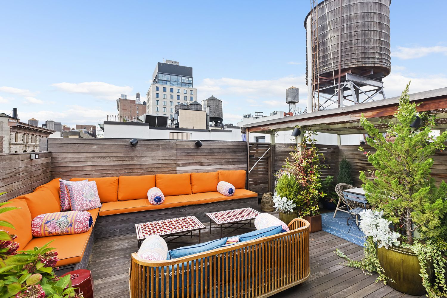 a view of swimming pool with outdoor seating and plants