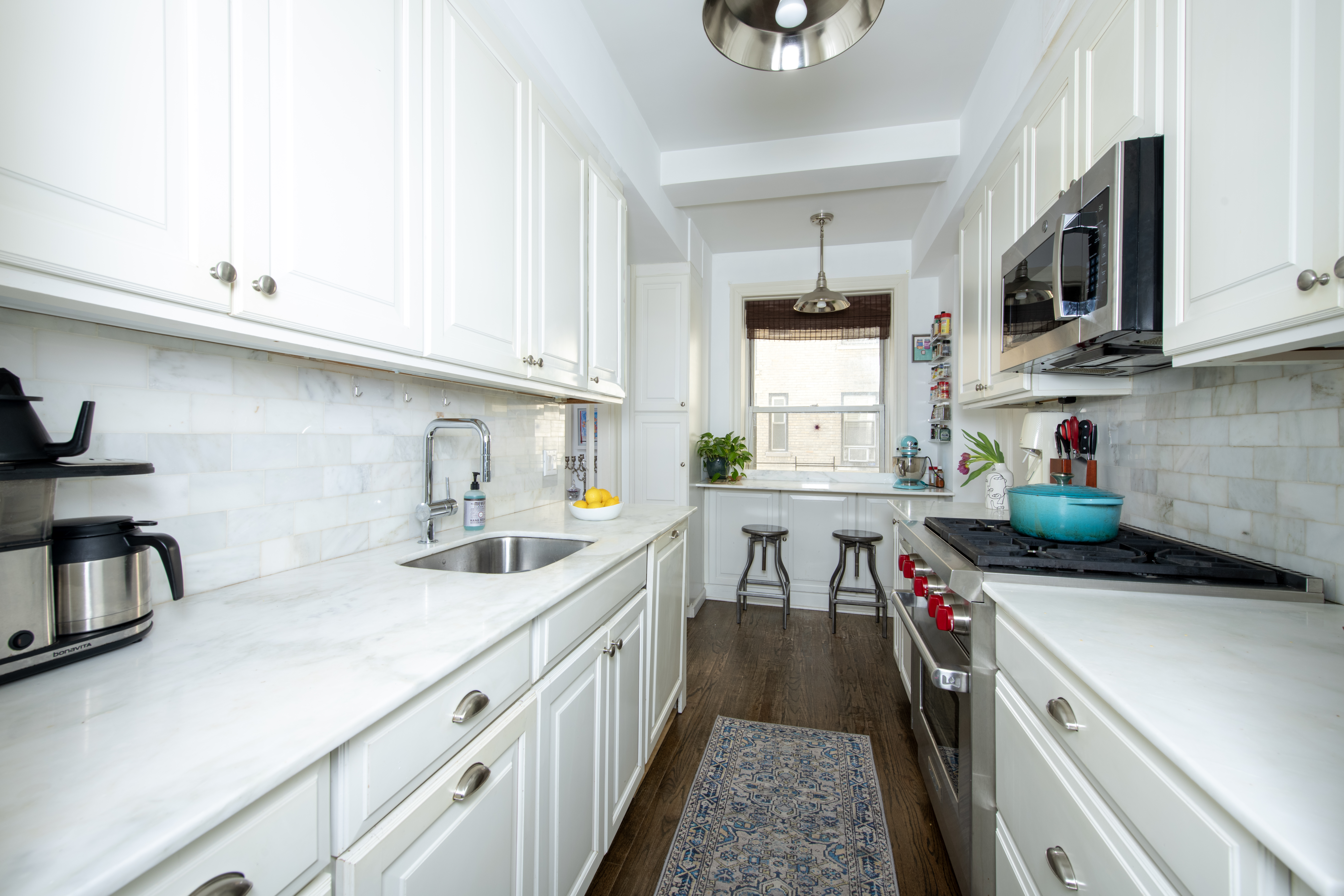 250 West 94th Street, Unit 3F Manhattan, NY 10025 - Photo 2 of 9 a kitchen with stainless steel appliances a sink a stove and cabinets