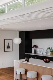 a bedroom with a bed and a mirror