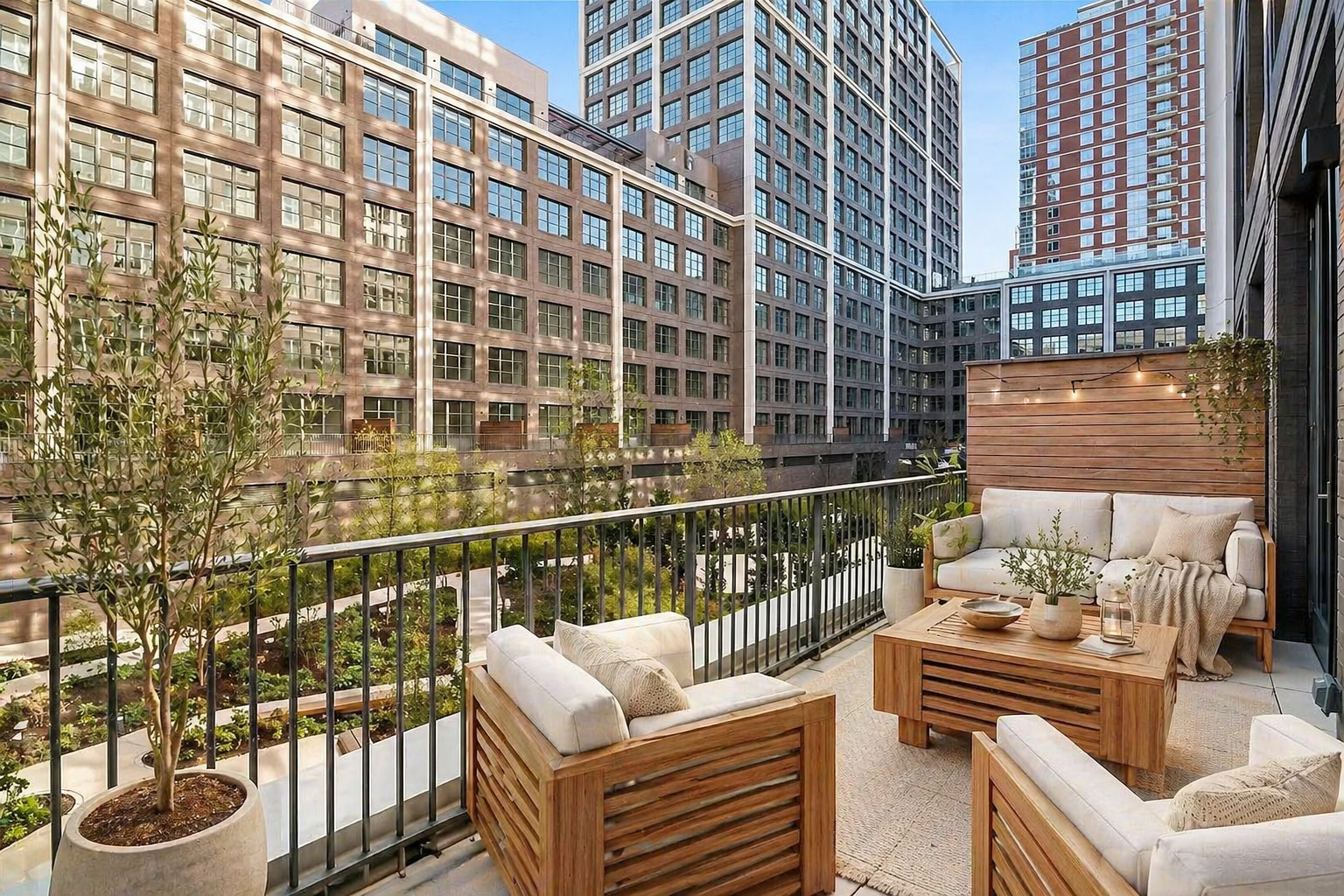 180 Front Street, Unit 2J Brooklyn, NY 11201 - Photo 2 of 22 a view of a balcony with two chairs and a potted plant