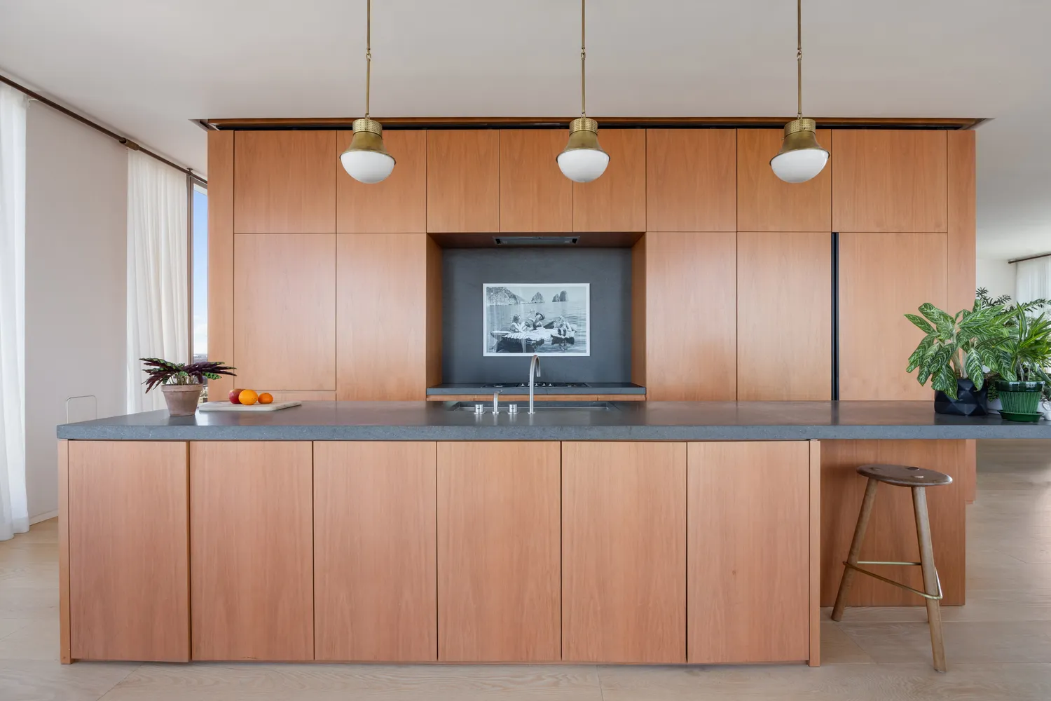 a room with pool table and windows
