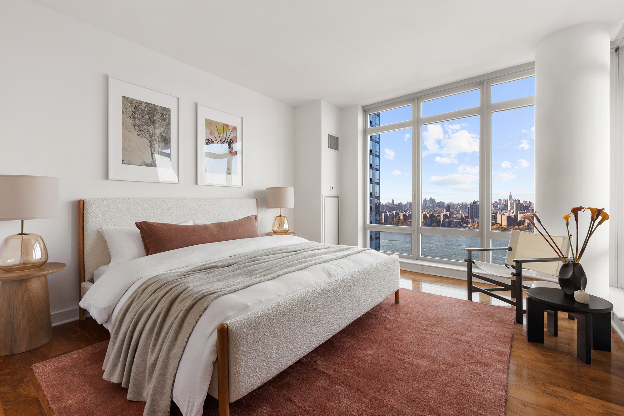 2 Northside Piers, Unit 25P Brooklyn, NY 11249 - Photo 10 of 26 a bedroom with a bed and a large window