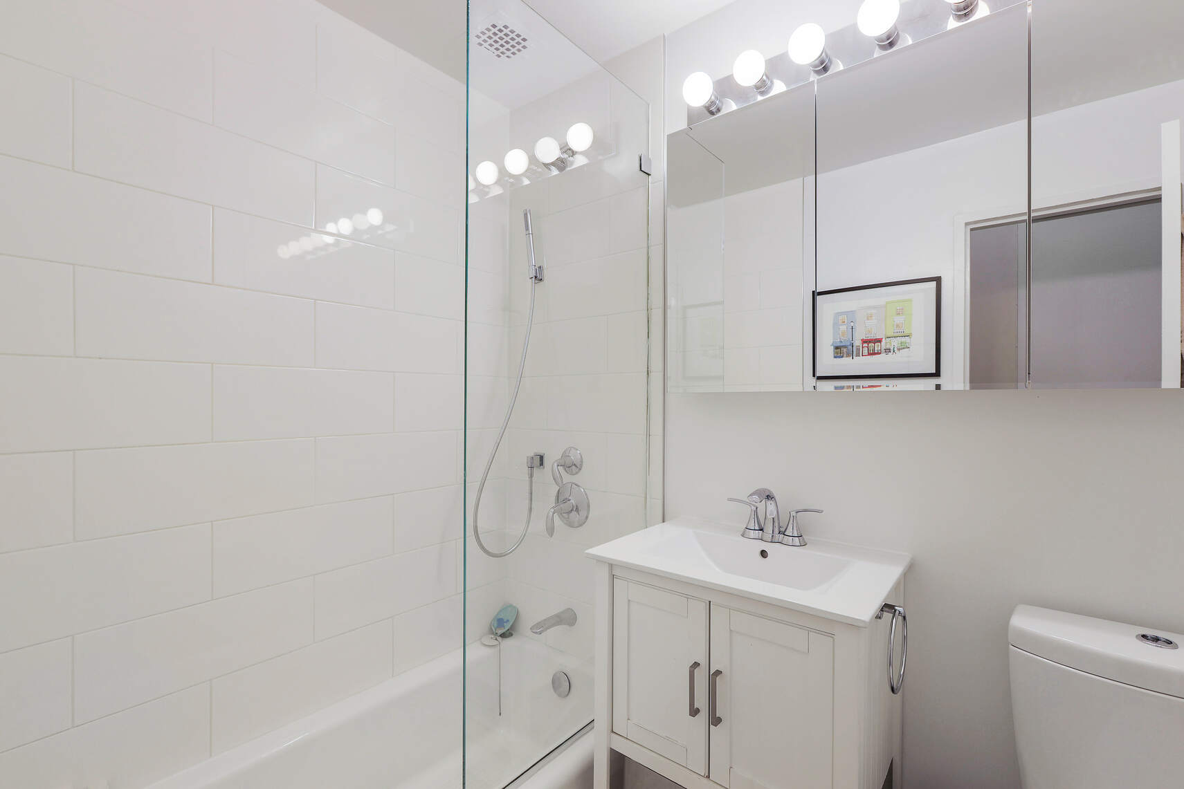 310 East 23rd Street, Unit 7C Manhattan, NY 10010 - Photo 13 of 18 a bathroom with a sink a toilet and shower