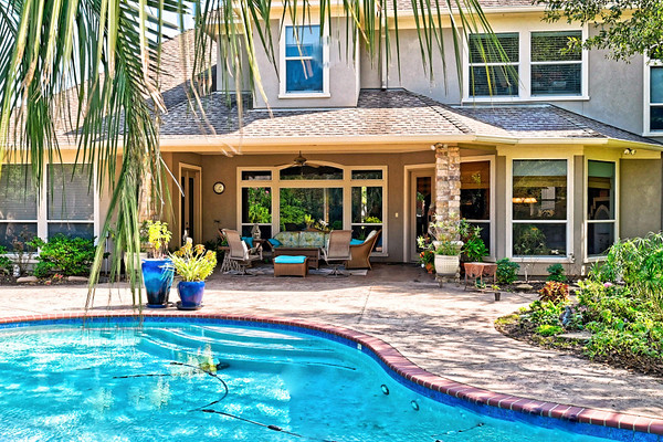 17311 Autumn Oak Court, Spring, TX, USA Spring, TX 77379 - Photo 5 of 9 a view of a house with backyard sitting area and porch