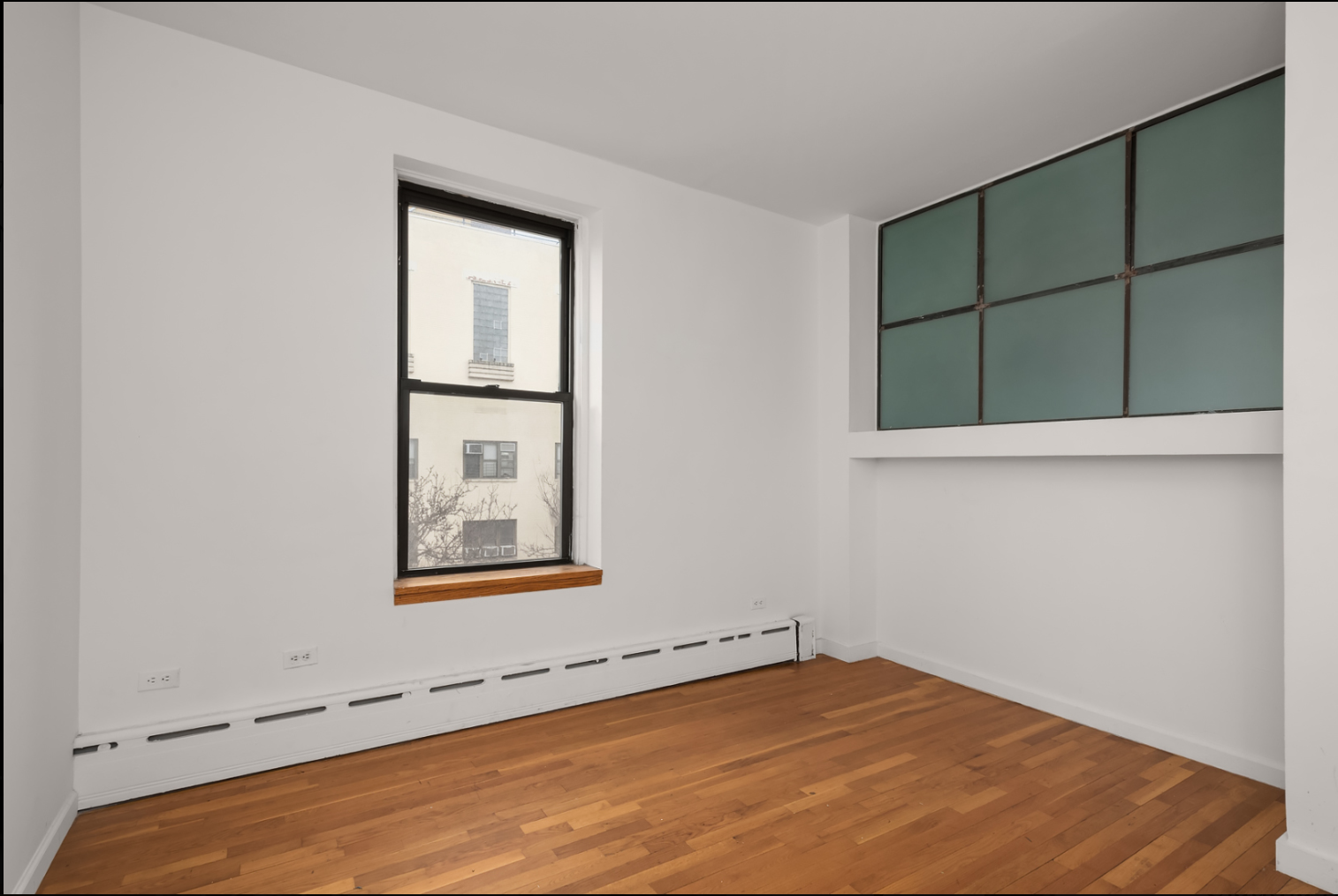 293 East 10th Street, Unit 4 Manhattan, NY 10009 - Photo 5 of 8 an empty room with window