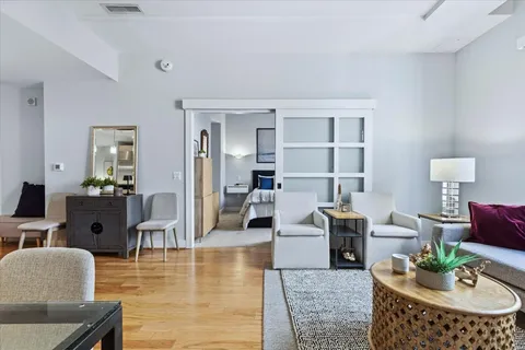a living room with furniture and a table