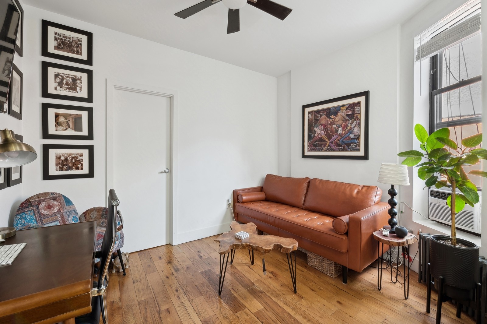 66 West 138th Street, Unit 3A Manhattan, NY 10037 - Photo 4 of 8 a living room with furniture and a window