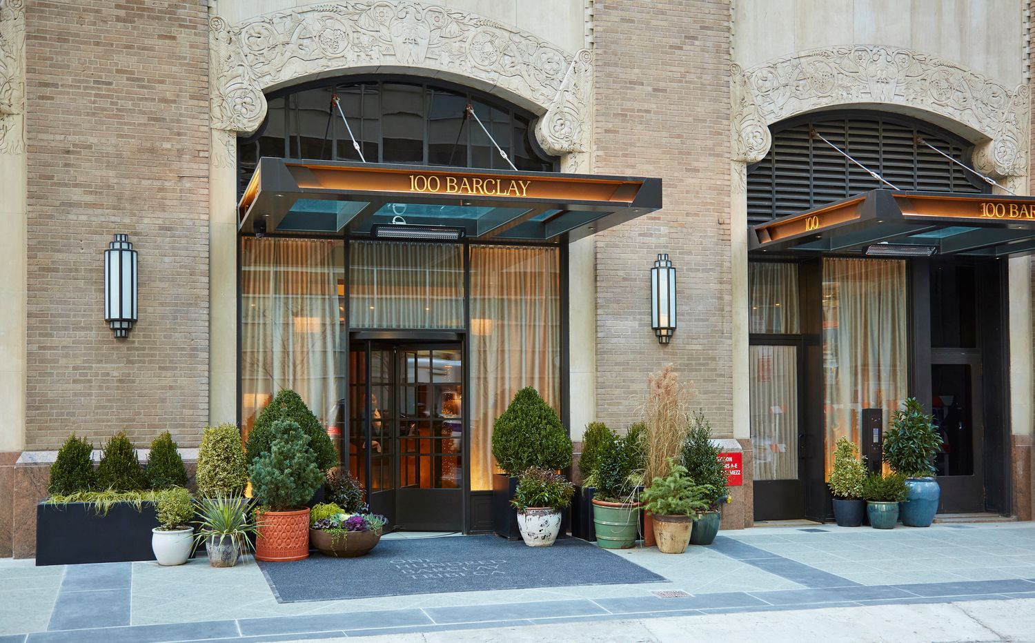 100 Barclay Street, Unit 17J Manhattan, NY 10007 - Photo 15 of 18 a front view of a house with plants